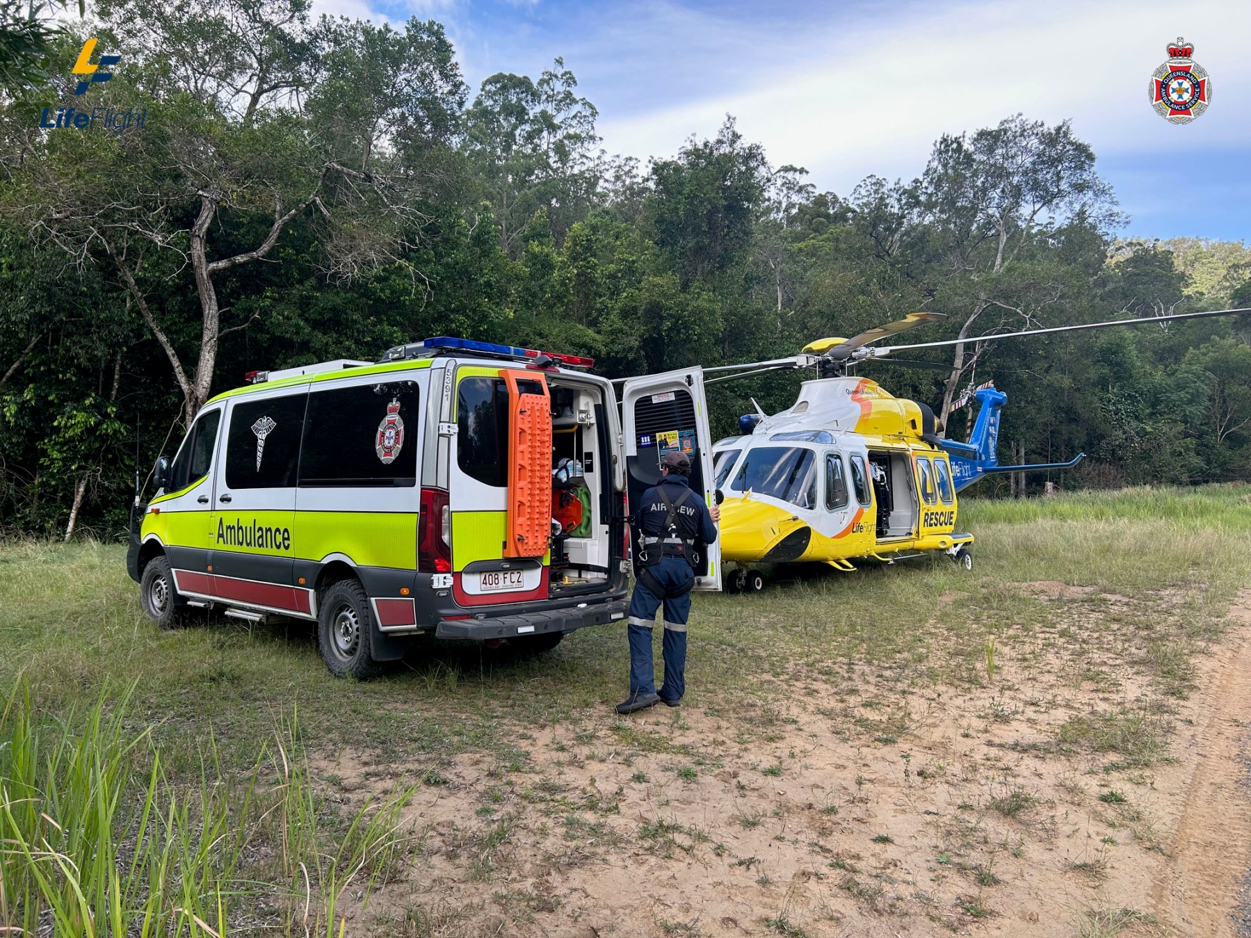 Photo: Queensland Ambulance Service and the Lifeflight Helicopter at the scene of the crash. Lifefligh. Supplied.